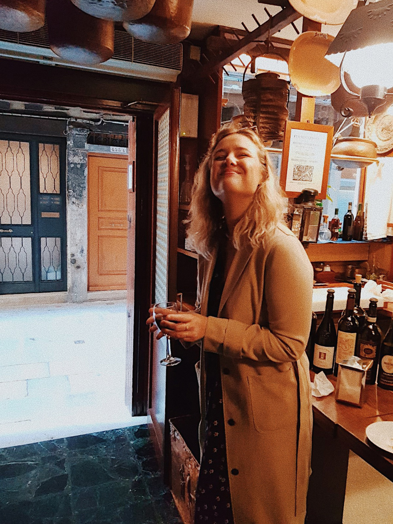 Blogger Sarah Witpeerd at wine bar in Venice Italy